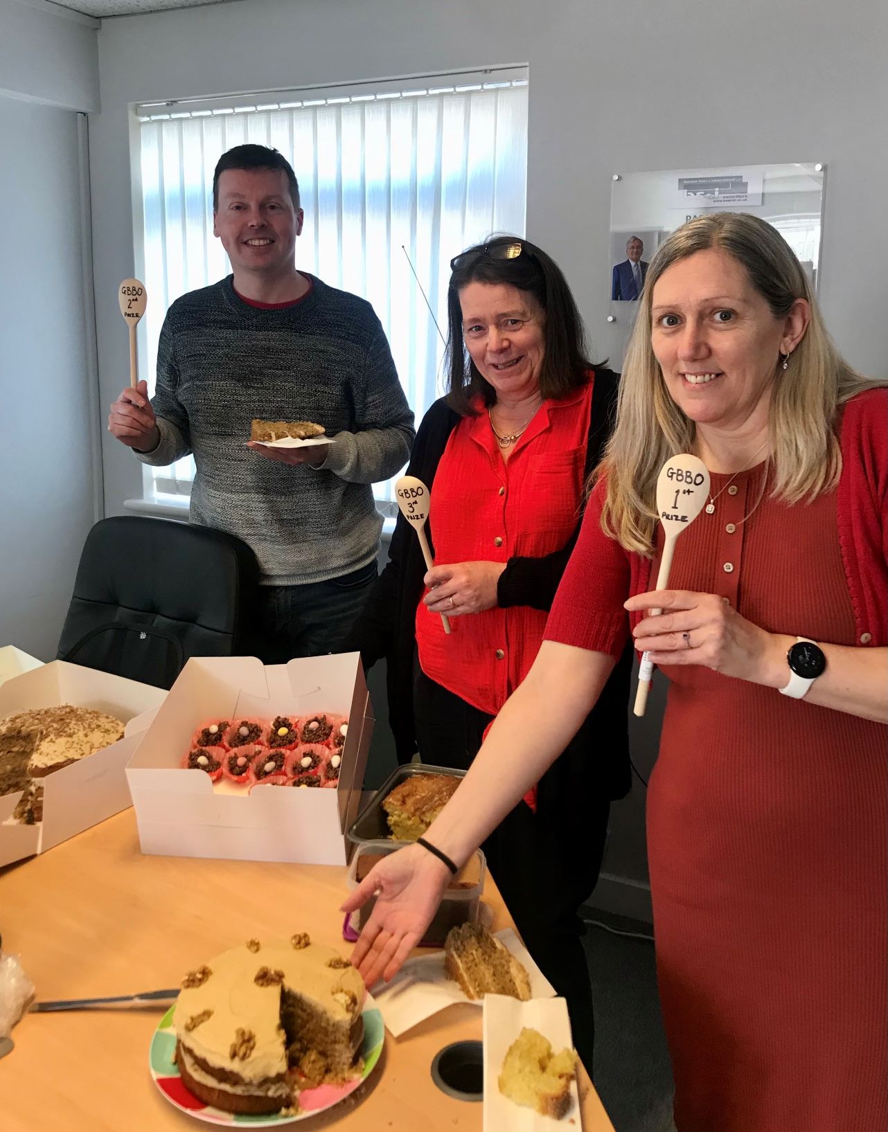 Picture of the break barkers bake off winners with their cakes.