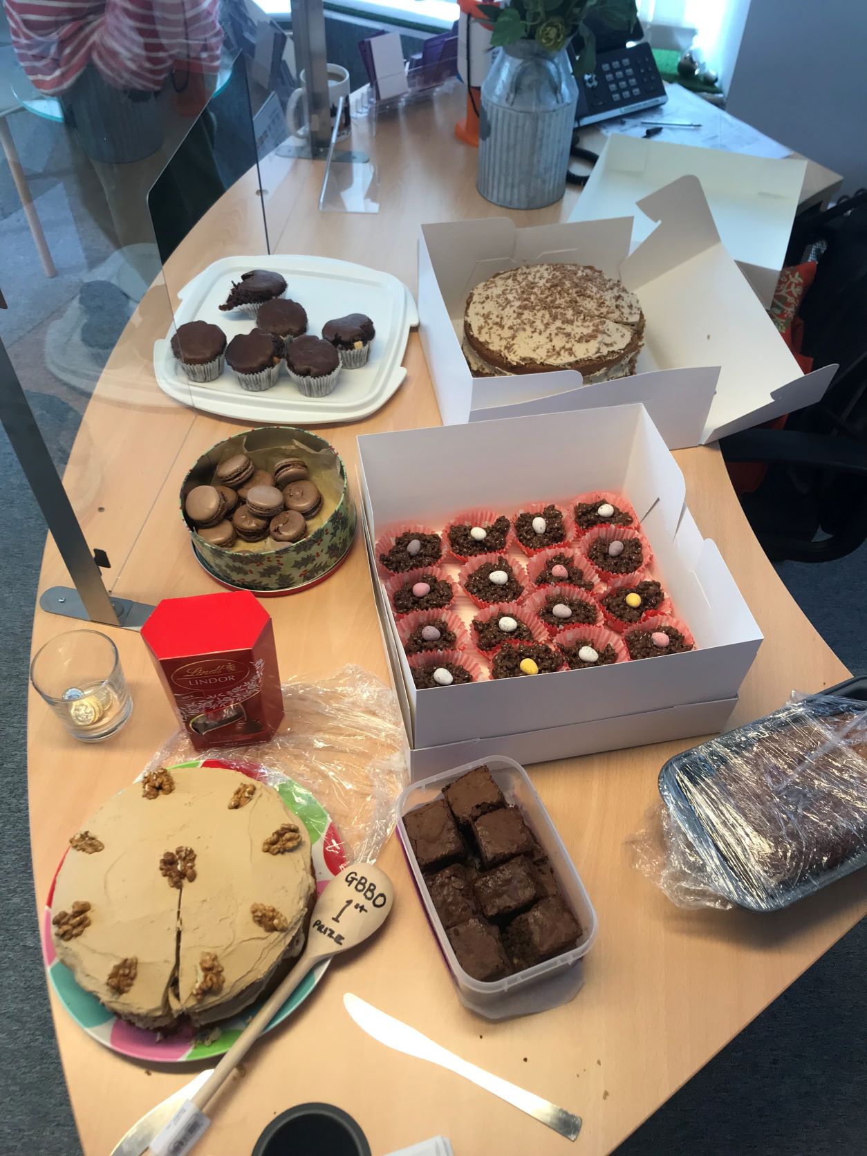 Plan view of a table filled with cakes and cupcakes for a competition.