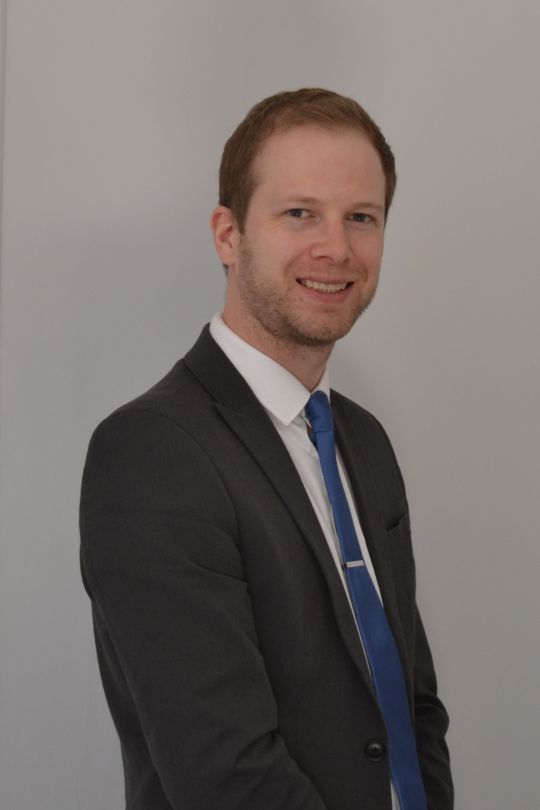 Andrew Guilfoyle smiling as new head of department.