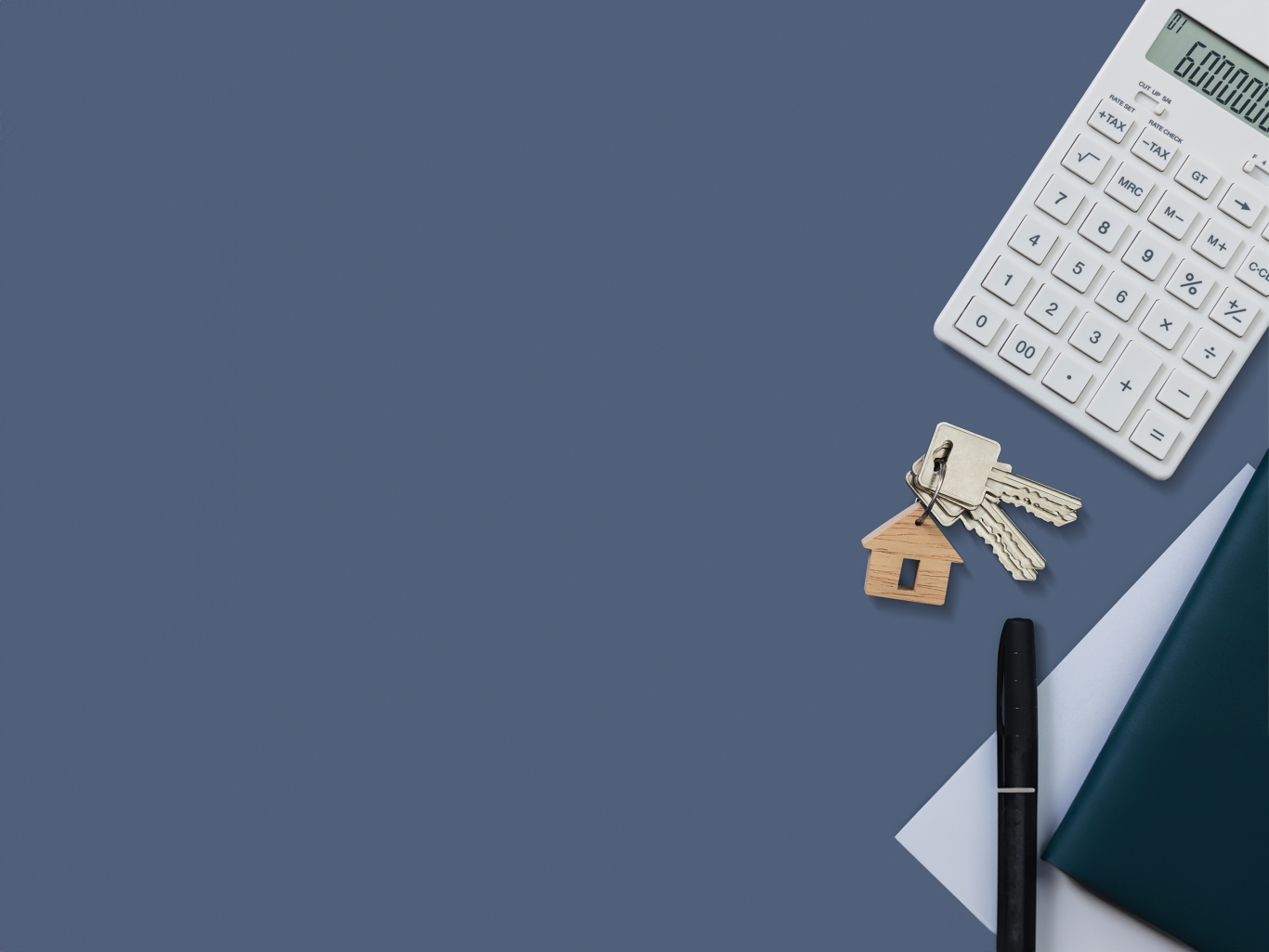 Property keyring with keys with a calculator and notepad.